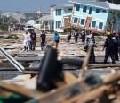 First responders and residents walk along a main street following Hurricane Michael in Mexico Beach, Florida, U.S.