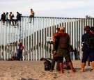 Migrants, part of a caravan of thousands trying to reach the U.S., gather at the border fence between Mexico and the United States after arriving in Tijuana, Mexico November 13, 2018.