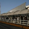 Mexican immigrants walk across the Paso del Norte border bridge after being deported from the United States amid the spread of the coronavirus disease (COVID-19), in Ciudad Juarez