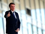 Brazil's President Jair Bolsonaro gestures as he stands at the ramp of the Planalto Palace, in Brasilia