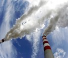 FILE PHOTO: Smoke billows from the chimneys of a coal-fired power plant in Poland