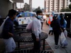 Guatemalan migrants are accompanied by Guatemalan government officials after being deported from the U.S. outside Guatemala's Air Force base in Guatemala City in Guatemala City, Guatemala.