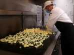 Image: A chef cooks vegetables at the Westin Bonaventure hotel 