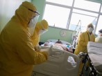 Nurses of Emergency Rescue Service (SAMU) prepare to transport a patient from an emergency health center to a hospital during the spread of the coronavirus disease (COVID-19) in Santo Andre, Sao Paulo State, Brazil.