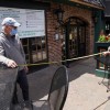 Closed since March 16th due the COVID-19 pandemic, Joe and Gerry McCoy, owners of Catherine Rooney's Irish pub, use a tape measure to ensure safe social distancing as they prepare for their June 1st re-opening in Wilmington, Delaware, US.