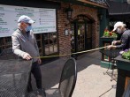 Closed since March 16th due the COVID-19 pandemic, Joe and Gerry McCoy, owners of Catherine Rooney's Irish pub, use a tape measure to ensure safe social distancing as they prepare for their June 1st re-opening in Wilmington, Delaware, US.