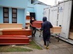 Workers carry a coffin outside of the crematorium at Angel Cemetery, where victims of COVID-19 are cremated in Lima, Peru.