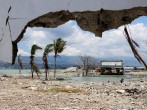 Ruins and damaged building are pictured nearly one year after an earthquake and tsunami at a beach in Palu, Central Sulawesi, Indonesia,