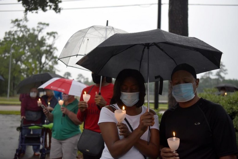 People participate in a vigil to honor George Floyd, who died in Minneapolis police custody, at Resurrection Metropolitan Community Church in Houston, Texas, US.