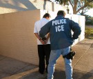 A U.S. Immigration and Customs Enforcement agent arresting a suspect.