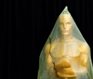 An Oscar statue stands covered with plastic during preparations leading up to the 87th Academy Awards in Hollywood, California