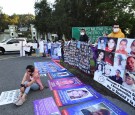 Relatives of missing people take part in a protest outside the 26-A Military Camp, where Mexico's President Andres Manuel Lopez Obrador holds a news conference, in El Lencero