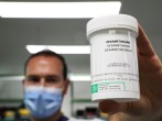 A pharmacist displays a box of Dexamethasone at the Erasme Hospital amid the coronavirus disease (COVID-19) outbreak, in Brussels