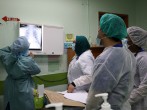 Health workers look at x-rays of a patient at Emergency Department in the Kuala Lumpur Hospital, amid the coronavirus disease (COVID-19) outbreak, in Kuala Lumpur