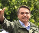 Jair Bolsonaro, far-right lawmaker and presidential candidate of the Social Liberal Party (PSL), gestures after casting his vote during general elections on October 28, 2018 in Rio de Janeiro, Brazil. 