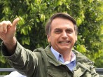 Jair Bolsonaro, far-right lawmaker and presidential candidate of the Social Liberal Party (PSL), gestures after casting his vote during general elections on October 28, 2018 in Rio de Janeiro, Brazil. 