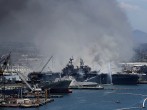 Navy Ship USS Bonhomme Richard Burns At Naval Base In San Diego