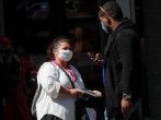 A U.S. Census worker takes the information from a man during a promotional event in Times Square in New York