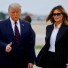 U.S. President Donald Trump walks with first lady Melania Trump at Cleveland Hopkins International Airport in Cleveland
