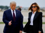 U.S. President Donald Trump walks with first lady Melania Trump at Cleveland Hopkins International Airport in Cleveland