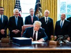 President Trump Signs Coronavirus Stimulus Bill In The Oval Office