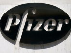 FILE PHOTO: FILE PHOTO: A sign is pictured outside Pfizer Headquarters in the Manhattan borough of New York City