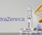 FILE PHOTO: A test tube labelled with the vaccine is seen in front of AstraZeneca logo in this illustration taken