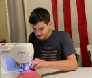 Florida Teen Saves and Repairs Torn American Flags