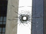 A hole in a window made by a stray bulle