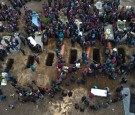 Guatemala Community Buries Victims 