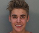 In this handout photo provided by Miami-Dade Police Department, pop star Justin Bieber poses for a booking photo at the Miami-Dade Police Department