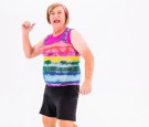 Elderly Woman In Black Shorts And Colorful Sleveless Shirt