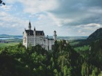 white concrete castle in green field