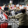 Florida: Protesters Wave Nazi Flag, Ron DeSantis Signs at Disney World