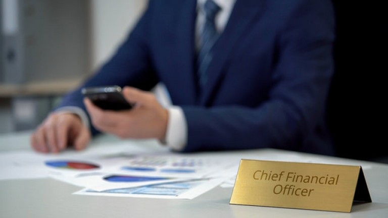 Busy chief financial officer of company using mobile app, working on report