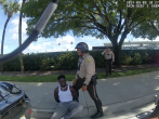 Bodycam footage of Miami-Dade Police shows an officer detaining Miami Dolphins player Tyreek Hill