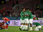 Players of Bolivia celebrate after winning the 2026 FIFA World Cup South American qualifiers football match against Chile 