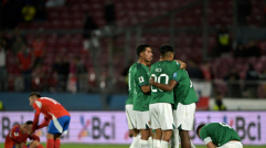 Players of Bolivia celebrate after winning the 2026 FIFA World Cup South American qualifiers football match against Chile 