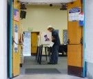 Voter in voting booth