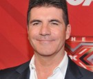 Simon-Cowell-poses-at-Fox-Television's-The-X-Factor-Season-Finale-at-CBS-Televison-City