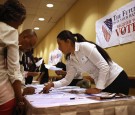 New American citizens register to vote following a naturalization ceremony on July 9, 2014 in New York City.