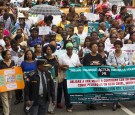 People take part in a march during commemorations for the UN's International Day for the Elimination of Violence Against Women