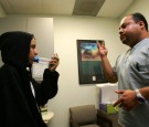 An asthma patient being instructed on treatment