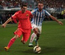 Barcelona's Lionel Messi and Sergi Darder of Malaga