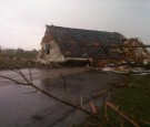 Dozens of tornadoes tore through the Midwest on Sunday at killed at least four people.