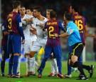 Real Madrid's Cristiano Ronaldo arguing with Barcelona Players