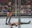 Randy Orton standing over WWE World Heavyweight Champion Seth Rollins.