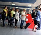 Cubans Await to Board a Plane to Miami