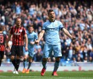 Sergio Aguero of Manchester City celebrates after scoring his team's fourth goal from the penalty spot during the Barclays Premier League match between Manchester City and Queens Park Rangers at the Etihad Stadium on May 10, 2015 in Manchester, England.