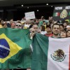 Fans Hold up Flags of Both Mexico and Brazil
